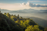 Fototapeta Do pokoju - Landscape of mountains spring forest with mist in sunrise time at Doi Inthanon National Park, High mountain in Chiang Mai Province, Thailand