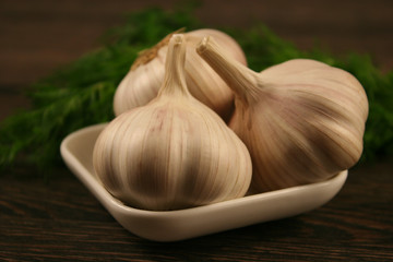 Garlic closeup on wooden background