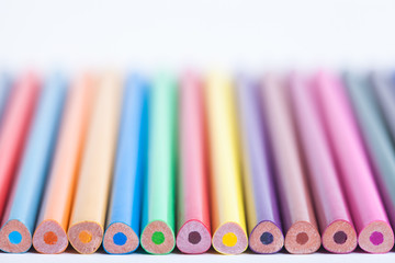 Wall Mural - Bright colored pencils in a blurred form. The image is blurred. Background of colored pencils. Selective focus. A place for a label.