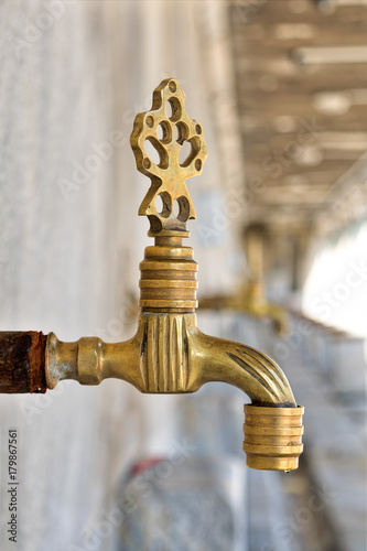 Fotografia, Obraz Turkish Ottoman style antique ablution tap with blurred background, Istanbul, Tu
