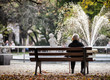 © leszekglasner - Depressed and sad old woman sitting alone on bench in park
