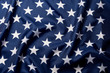 © Vladyslav Bashutskyy - Beautifully waving stars of American flag close up background.