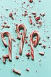 Xmas Candy cane and broken crushed pieces on greenish background with copy space