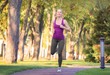 © Africa Studio - Sporty young woman running in park