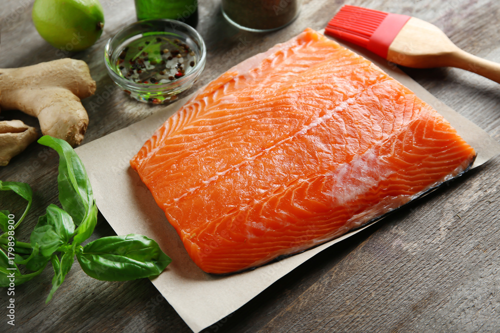 Fresh raw salmon fillet ready for marinating on table