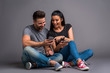 © Spectral-Design - Nice young couple sitting in the studio