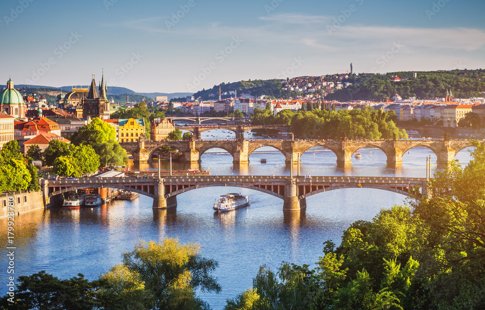 Charles Bridge (Karluv Most) and Lesser Town Tower, Prague in summer at sunset, Czech Republic - obrazy, fototapety, plakaty 