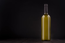 Green Bottle Of White Wine Mock Up On Elegant Dark Black Wooden Background, Copy Space. Template For Portfolio, Advertising, Design, Branding Identity, Cover Magazine, Bar And Restaurant Menu.