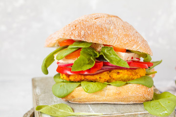 Vegan lentils burger with tofu and vegetables.