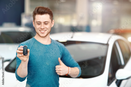 Key Car Dealership >> Happy New Car Owner Is Showing Thumbs Up And His Car Key Key Car Dealership >> Happy New Car Owner Is Showing Thumbs Up And His Car Key