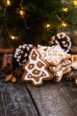 Christmas Gingerbread on a wooden table with decorations.Copy space