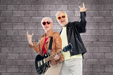 Poster - senior couple with guitar showing rock hand sign