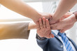 © paulfourk - business team work concept : business people hold hand together ,professional agreement partnership community
