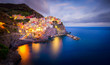 canvas print picture - View of the city and port of Manarola, one of the Cinque Terre, a beautiful gem and famous destination in the Mediterranean sea