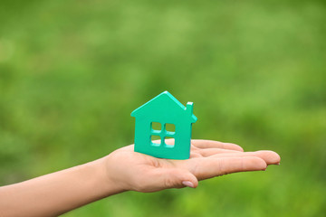 Sticker - Woman with figure of house on blurred background