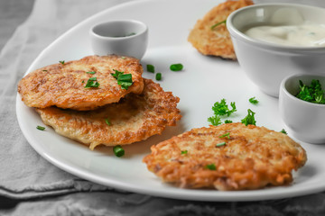 Poster - Plate with Hanukkah potato pancakes on table, closeup