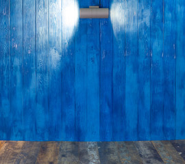 Wall Mural - light projectors on a blue wooden background