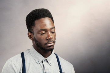 Wall Mural - young attractive afro american black man in sad mood