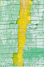 Textured Green Peeling Paint With A Yellow Crack