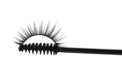 Wall Mural - Mascara brush and false eyelashes on white background