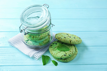 Wall Mural - Jar with mint chocolate chip cookies on wooden table