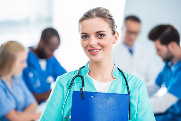 Wall Mural - nurse holding clipboard