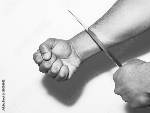 Fotografie, Tablou Man want to commit suicide by cutting his veins with knife on white background