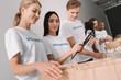 © LIGHTFIELD STUDIOS - volunteers packing food for charity