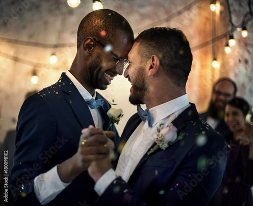Smiling couple dancing on their wedding day Canvas