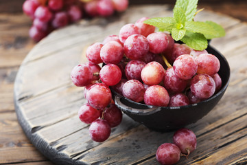 Canvas Print - Sweet red grape on the wooden table