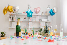Champagne And Confetti After Office Party In The Meeting Room