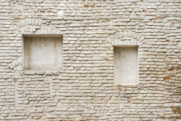 Wall Mural - abandoned grunge cracked brick stucco wall with a stucco frame