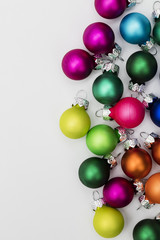 Festive Christmas baubles on a plain white background