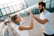 © NDABCREATIVITY - Portrait of young attractive happy fitness couple