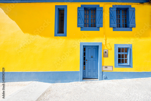 Fotografie, Obraz Beautiful yellow building facade in the old town of Aveiro city in Portugal