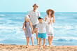 © Africa Studio - Happy family on sea beach at resort