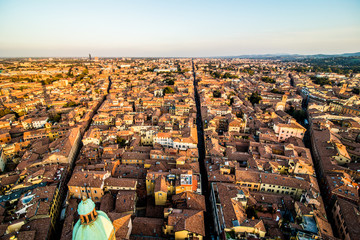 Aerial view of Bologna, Italy at sunset. Colorful sky over the historical city center and old buildings