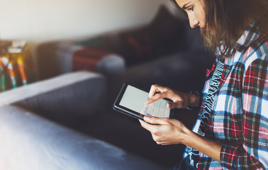 Wall Mural - Hipster girl using tablet technology in home atmosphere, girl person holding computer with blank screen on background bokeh, female hands texting on relax holiday, templates gadget, blur lifestyle