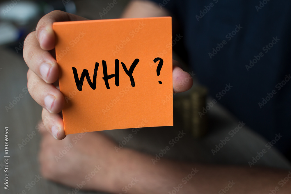Hand holding an orange Paper with the word why - Why?, Business Concept - obrazy, fototapety, plakaty 