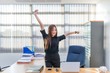 © reewungjunerr - Asian officer woman stretching body at the desk of office