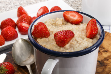 Wall Mural - healthy breakfast with porridge and strawberry