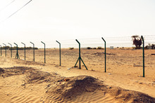 Barbed Wire Fence In The Desert