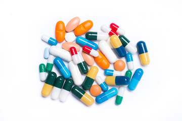 Wall Mural - colored pills and capsule on white background