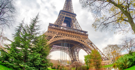 Poster - Wide angle upward view of Tour Eiffel as seen from surrounding g