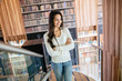 © NDABCREATIVITY - Beautiful brunette in library