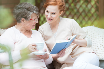 Wall Mural - Elder woman in garden