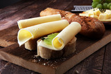 Fototapeta  - Cheese slices on bread or baghuette and grapes