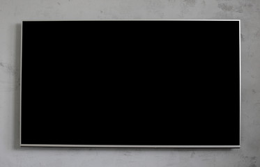 Fototapete - Empty black television screen on concrete wall
