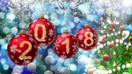 Wall Mural - red balls with numbers 2018 hanging on the background of a blue bokeh and a rotating christmas tree 