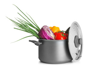 Canvas Print - Saucepan with vegetables on white background